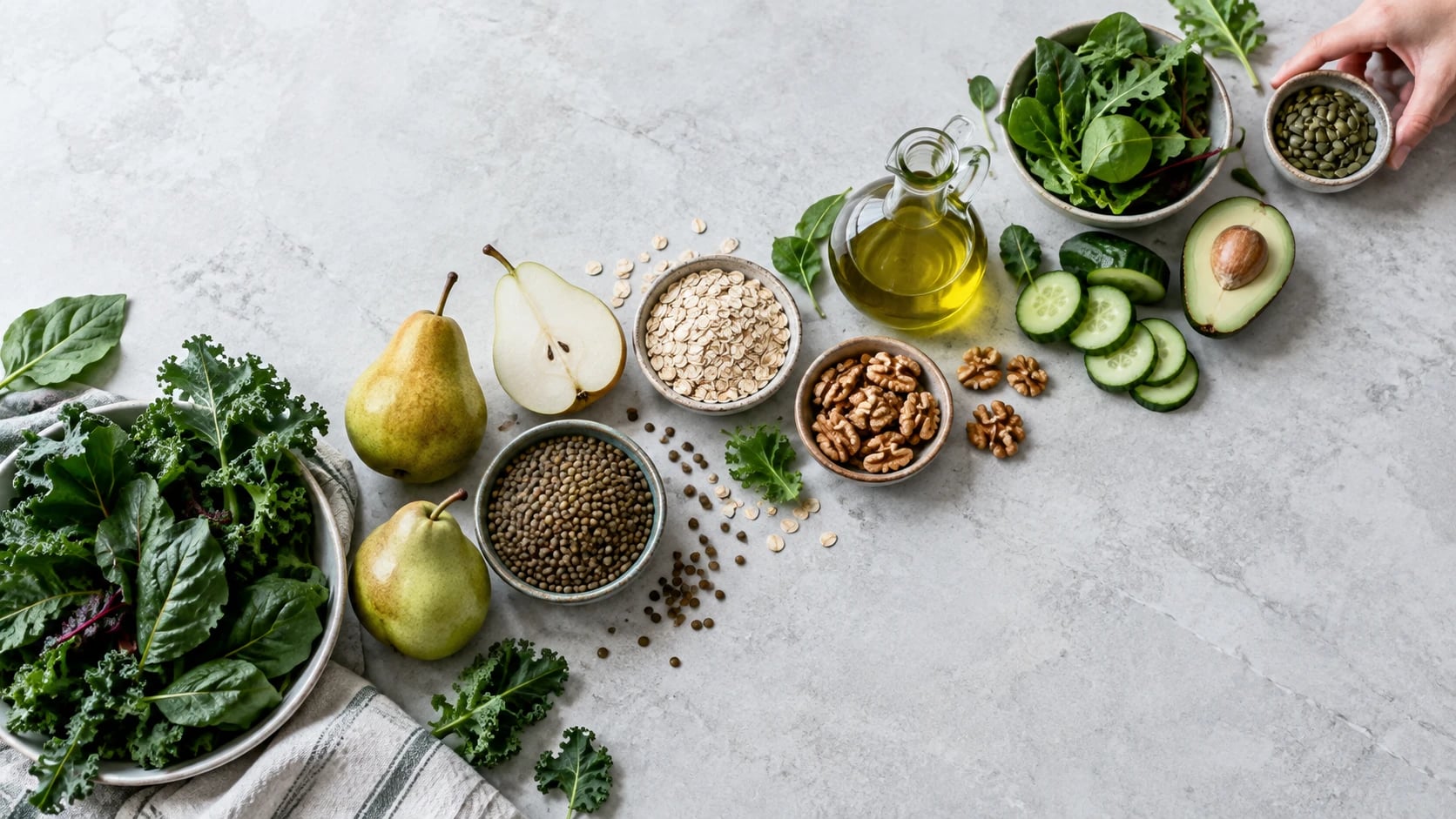 Editorial still life of leafy greens, lentils, oats, nuts and fresh ingredients